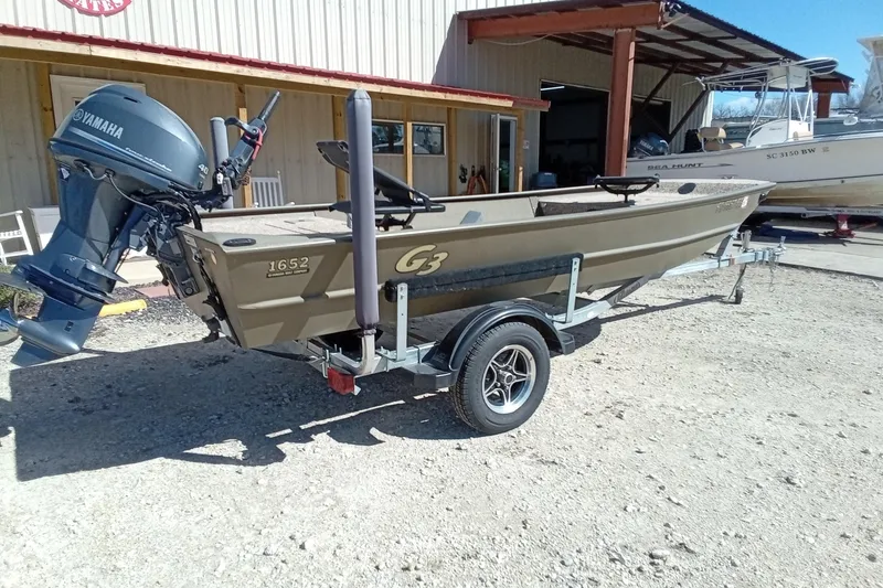 Slide: The Image of 2024 G3 Gator Tough 1652 VBW boat on trailer with Yamaha outboard motor. - 20
