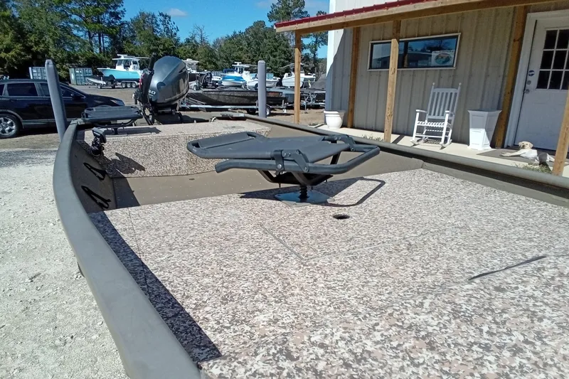 Slide: The Image of 2024 G3 Gator Tough 1652 VBW boat displayed outdoors near a building. - 6