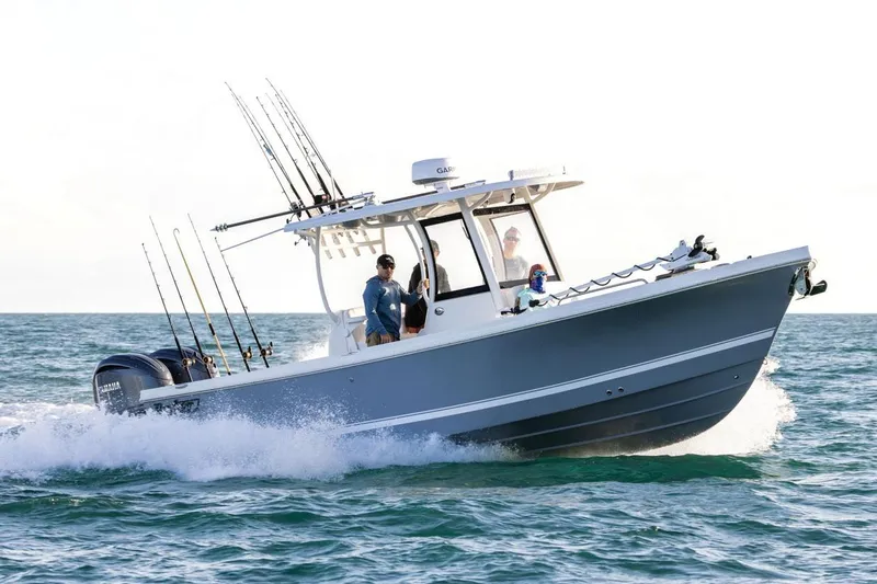 The Image of Manufacturer Provided Image: 2026 Parker 294 Fathom boat cruising on ocean with fishing rods and passengers. - 0