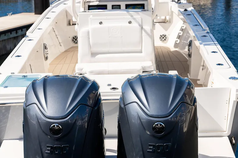 Slide: The Image of Manufacturer Provided Image: 2026 Parker 294 Fathom boat with dual 300 horsepower engines, docked in marina. - 11