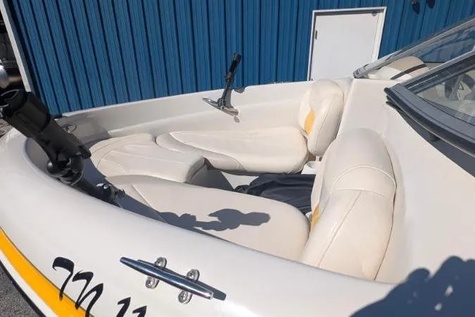 Slide: The Image of 2012 Tahoe Q5L I/O boat with white leather seats and blue exterior. - 4