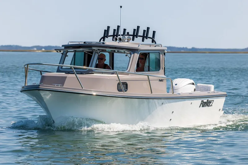 The Image of Manufacturer Provided Image: 2026 Parker 217 Explorer boat cruising on calm waters. - 0