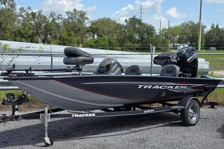 The Image of 2020 Tracker Pro Team 175 TF fishing boat on trailer, parked outdoors. - 0