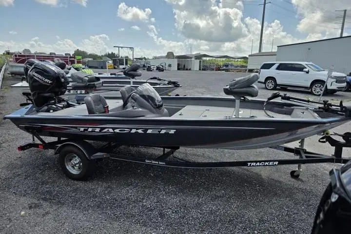 Slide: The Image of 2020 Tracker Pro Team 175 TF boat on trailer in outdoor lot. - 11
