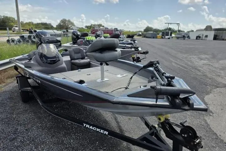 Slide: The Image of 2020 Tracker Pro Team 175 TF boat on trailer in outdoor lot. - 12