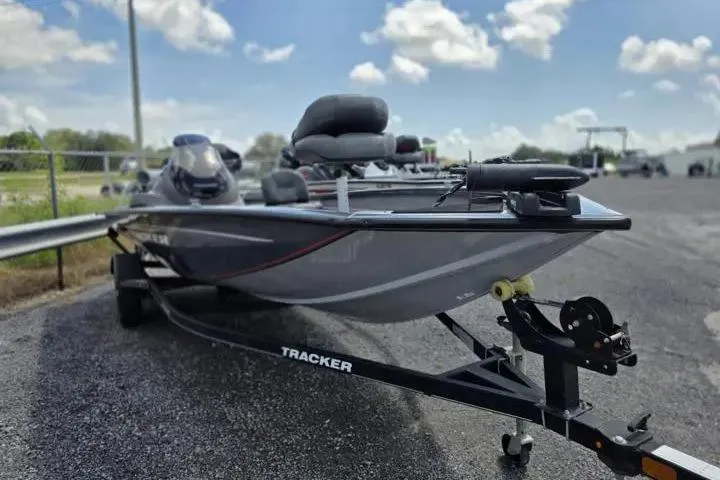 Slide: The Image of 2020 Tracker Pro Team 175 TF boat on trailer under a blue sky with clouds. - 13