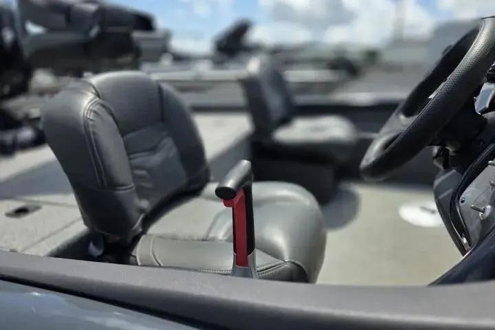 Slide: The Image of 2020 Tracker Pro Team 175 TF boat interior with steering wheel and seats. - 16