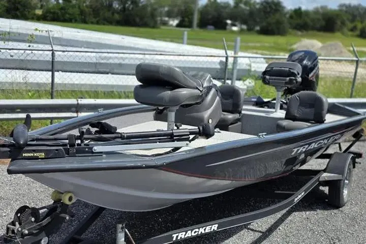 Slide: The Image of 2020 Tracker Pro Team 175 TF fishing boat on trailer, parked outdoors. - 2