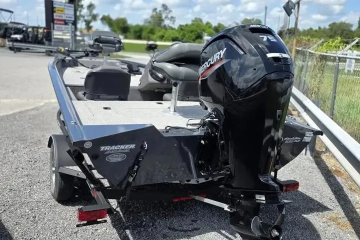Slide: The Image of 2020 Tracker Pro Team 175 TF boat with Mercury 75 engine, parked outdoors. - 4