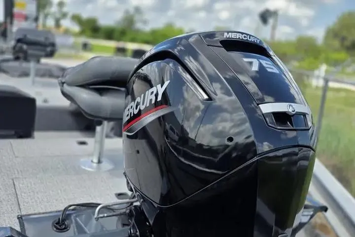Slide: The Image of 2020 Tracker Pro Team 175 TF with Mercury outboard motor, outdoor setting. - 7