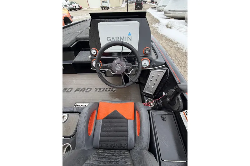 Slide: The Image of 2023 Blazer 650 Pro Tour boat cockpit with Garmin navigation system. - 8