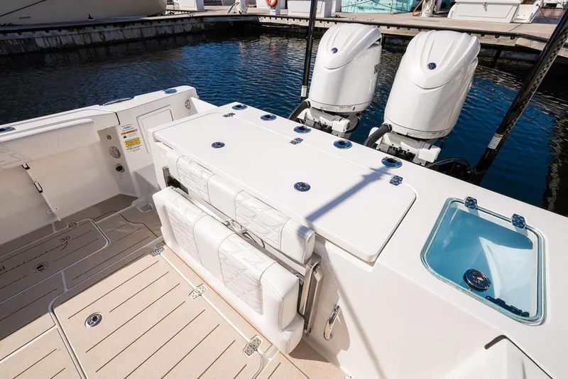 Slide: The Image of Manufacturer Provided Image: 2026 Parker 247 Explorer boat with dual engines, spacious deck, and seating at the marina. - 9