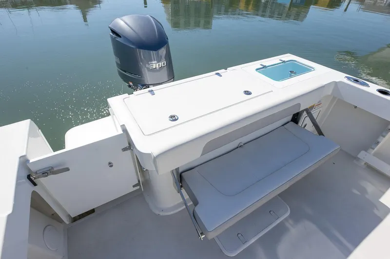 Slide: The Image of Manufacturer Provided Image: 2026 Parker 257 Explorer boat with Yamaha 300 engine, featuring a foldable bench seat. - 9