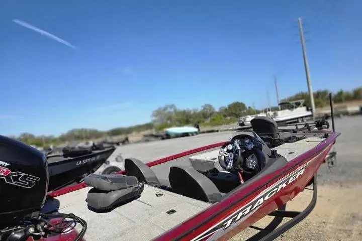 Slide: The Image of 2021 Tracker Pro Team 195 TXW Tournament Edition boat parked outdoors. - 12