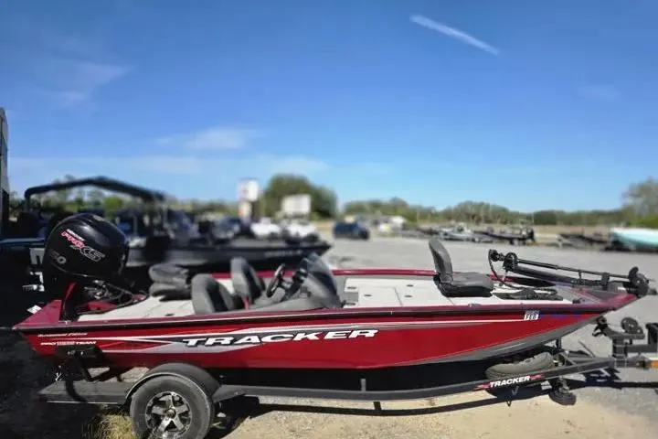 Slide: The Image of 2021 Tracker Pro Team 195 TXW Tournament Edition boat in a parking lot. - 13