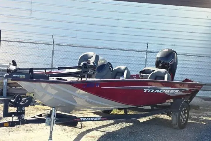 The Image of 2021 Tracker Pro Team 195 TXW Tournament Edition boat, red and silver, on a trailer. - 5