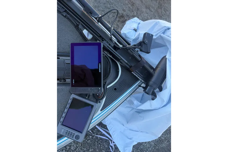 Slide: The Image of 2012 Triton 21HP boat with Lowrance electronics and trolling motor on deck. - 8