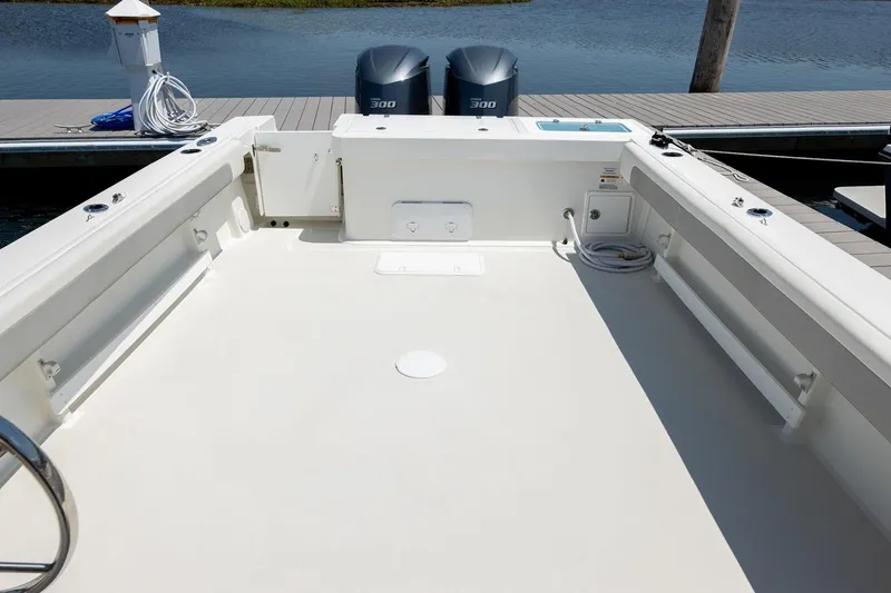 Slide: The Image of Manufacturer Provided Image: 2026 Parker 287 Explorer boat deck with twin 300 engines at dock. - 12