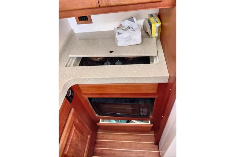 Slide: The Image of 1999 Viking 45 Convertible yacht kitchen with stove and microwave. - 38