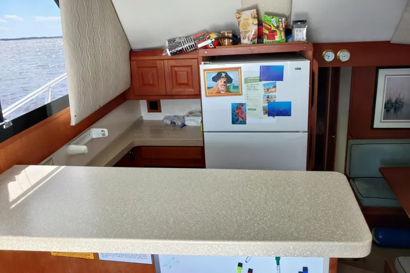 Slide: The Image of Interior of 1999 Viking 45 Convertible yacht with kitchen and ocean view. - 41