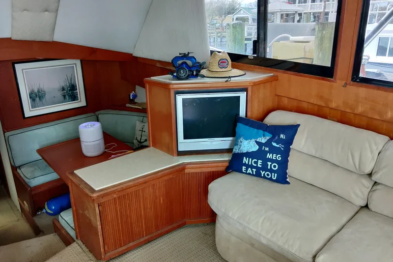 Slide: The Image of Interior of 1999 Viking 45 Convertible yacht with cozy seating and decor. - 47