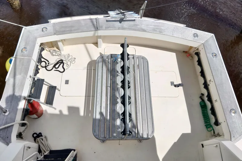 Slide: The Image of 1999 Viking 45 Convertible boat deck with fishing rod holders and equipment. - 6