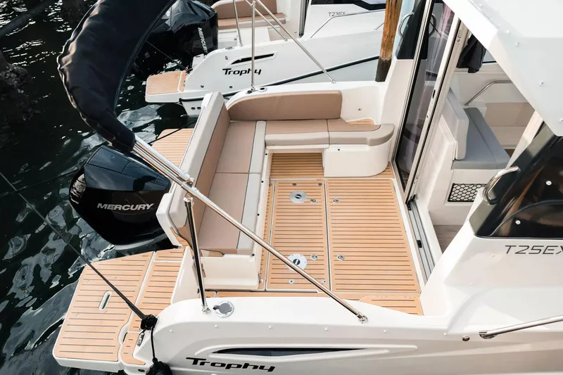 Slide: The Image of 2026 Trophy T25EX EXPLORER OB boat with Mercury engine, featuring spacious deck and seating. - 10