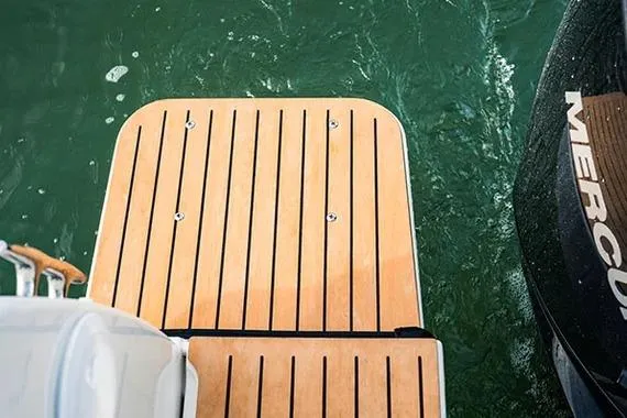 Slide: The Image of 2026 Trophy T25EX EXPLORER OB boat deck with Mercury engine on water. - 11