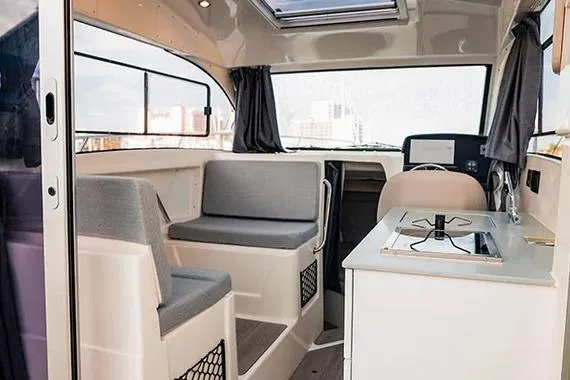 Slide: The Image of Interior of 2026 Trophy T25EX EXPLORER OB boat with seating and kitchenette. - 12