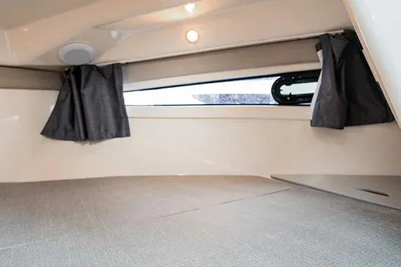 Slide: The Image of 2026 Trophy T25EX EXPLORER OB cabin interior with window and curtains. - 18