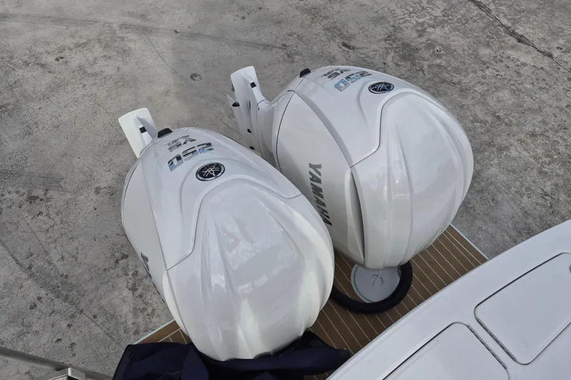 Slide: The Image of Twin Yamaha outboard engines on a 2026 Regulator 25 boat, viewed from above. - 15