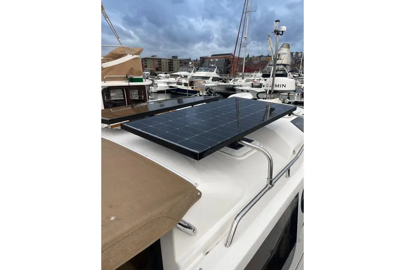 Slide: The Image of 2026 Ranger Tug R-27 with solar panel on deck, docked in marina. - 3