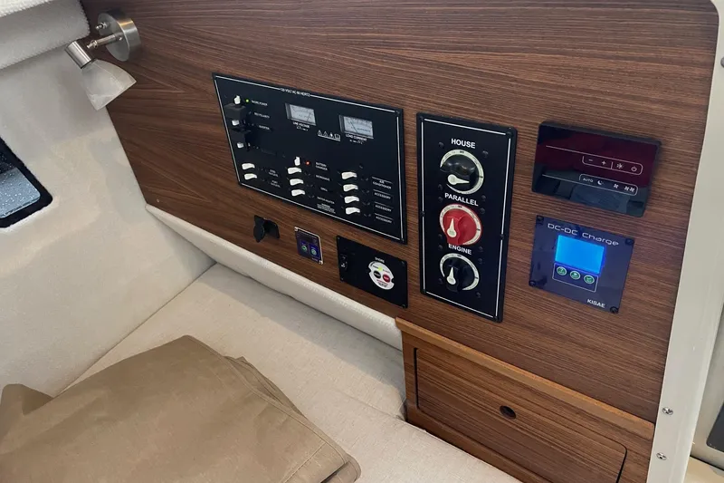 Slide: The Image of Control panel of 2026 Ranger Tug R-27 with switches and DC-DC charger. - 6