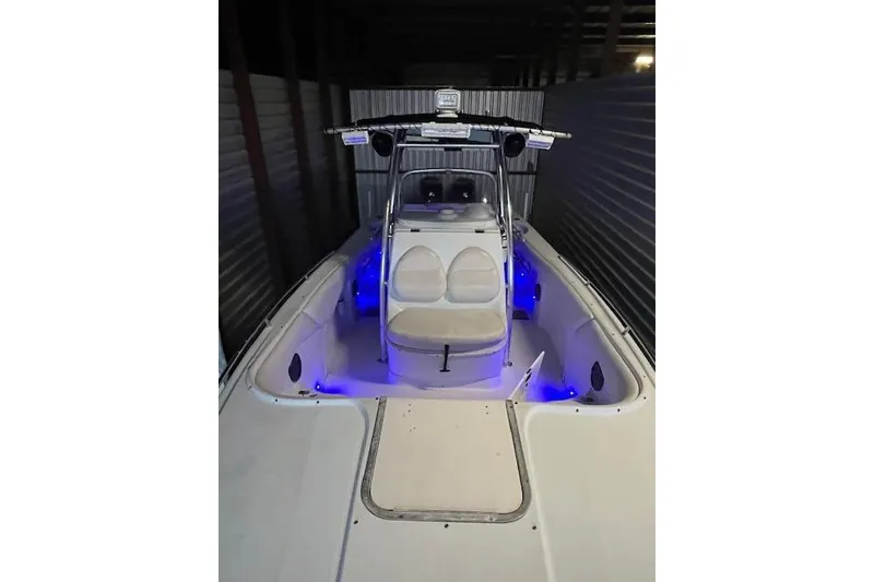 Slide: The Image of 2002 Baja 340 Islander Outboard boat with blue interior lighting in storage. - 10