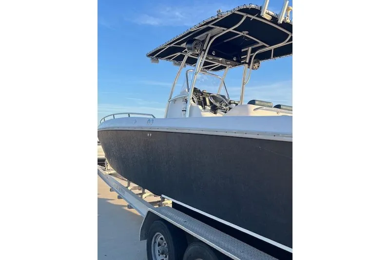 Slide: The Image of 2002 Baja 340 Islander Outboard boat on trailer under clear blue sky. - 3