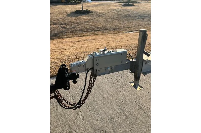 Slide: The Image of Trailer hitch of a 2002 Baja 340 Islander Outboard on a sunny day. - 8