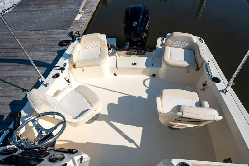 Slide: The Image of Manufacturer Provided Image: 2026 Scout 188 Sport Dorado boat interior with seating and steering wheel. - 6