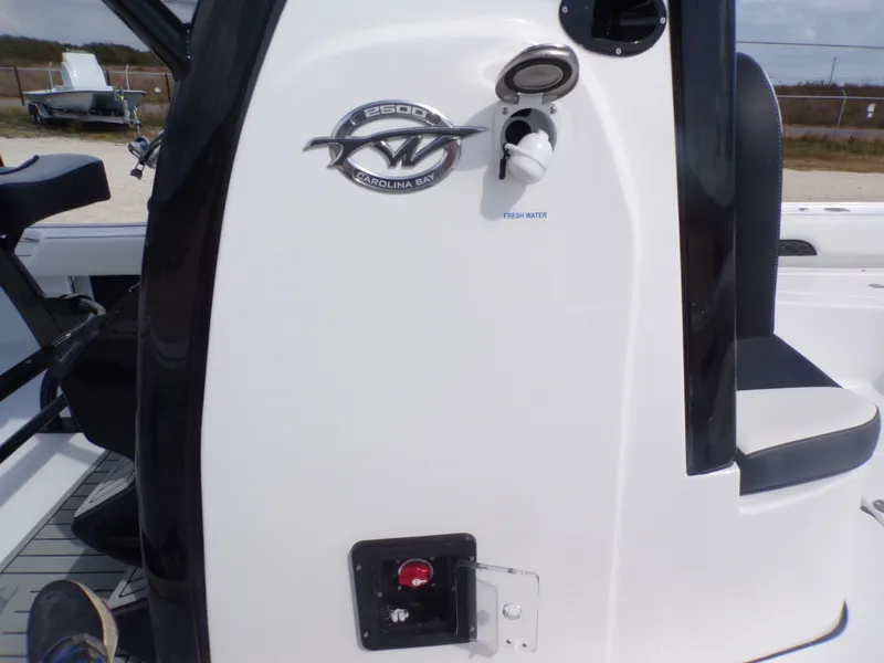 Slide: The Image of Tidewater 2500 Carolina Bay 2026 boat console with freshwater connection. - 14