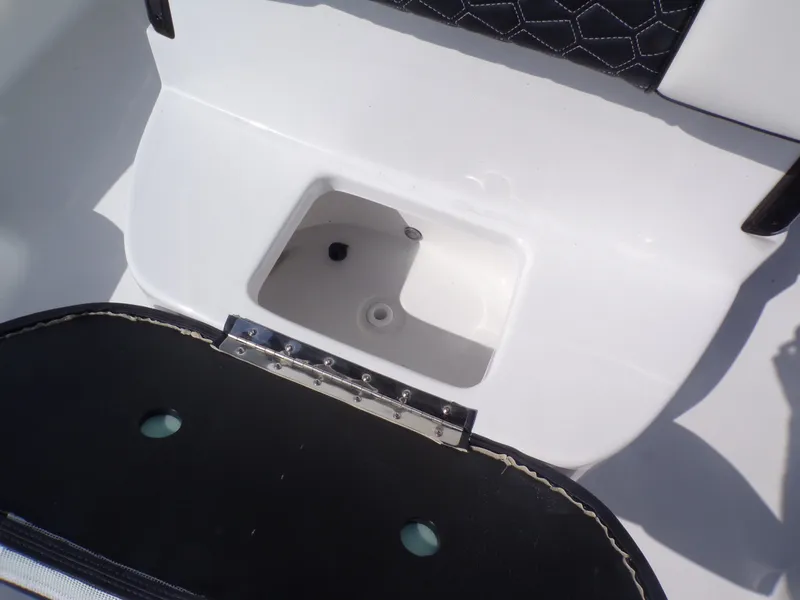 Slide: The Image of Tidewater 2500 Carolina Bay 2026, open storage compartment. - 26