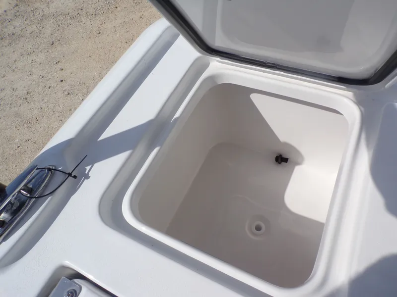Slide: The Image of Open storage compartment in 2026 Tidewater 2500 Carolina Bay boat. - 34