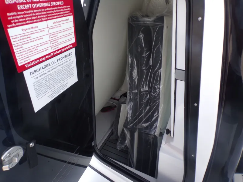 Slide: The Image of Interior of 2026 Tidewater 2500 Carolina Bay with warning labels. - 39