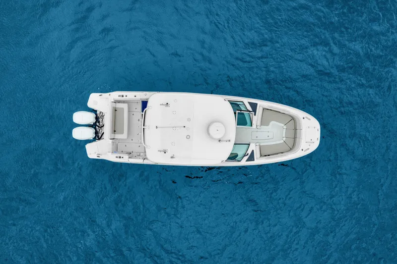 Slide: The Image of Aerial view of 2018 Boston Whaler 320 Vantage boat on blue ocean water. - 11