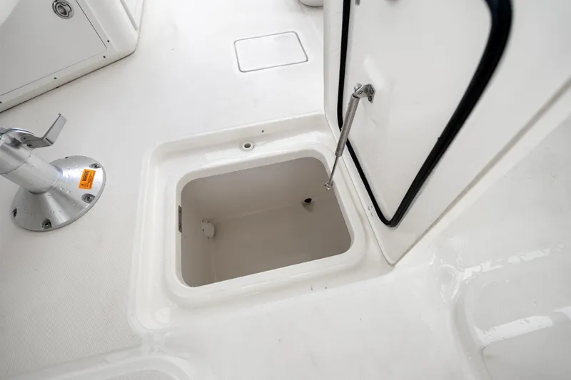 Slide: The Image of Open storage compartment on 2018 Boston Whaler 320 Vantage boat deck. - 28