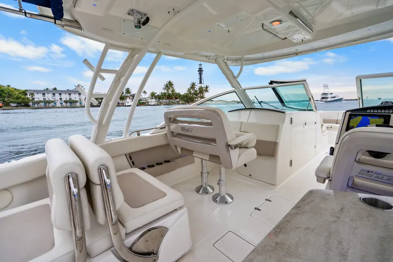 Slide: The Image of 2018 Boston Whaler 320 Vantage boat interior with seating and ocean view. - 37