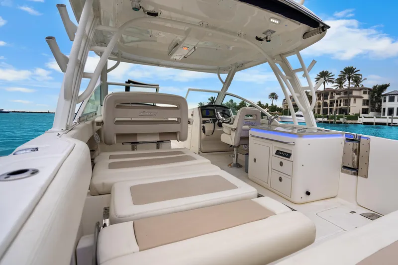 Slide: The Image of 2018 Boston Whaler 320 Vantage boat interior with seating and ocean view. - 38