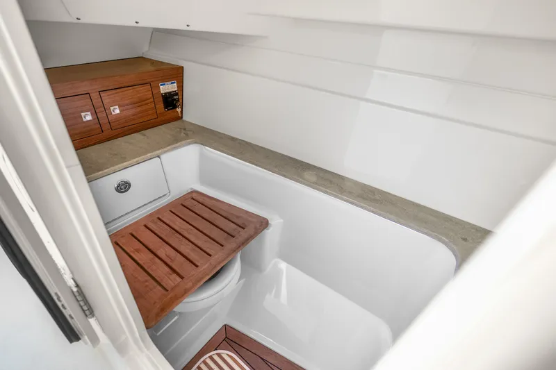 Slide: The Image of 2018 Boston Whaler 320 Vantage interior with wooden cabinetry and seating. - 43