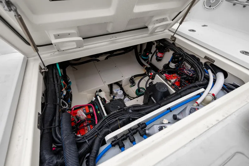 Slide: The Image of Engine compartment of 2018 Boston Whaler 320 Vantage, showcasing wiring and components. - 48