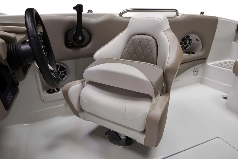 Slide: The Image of 2024 Crownline Eclipse E210 XS boat interior with luxurious captain's seat and steering wheel. - 7