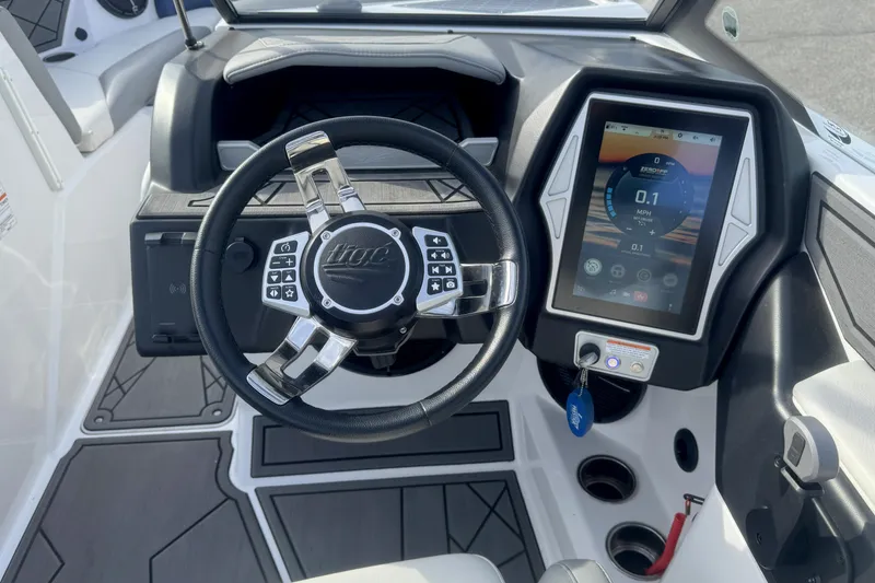 Slide: The Image of 2022 Tigé Z3 boat dashboard with touchscreen display and modern steering wheel. - 10