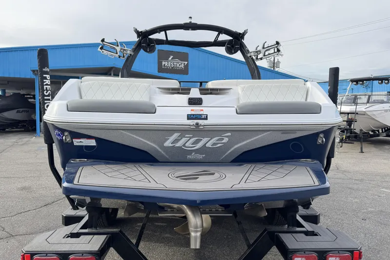 Slide: The Image of 2022 Tigé Z3 boat rear view at dealership, showcasing sleek design and branding. - 5